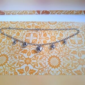 Silver tone necklace with heart charms